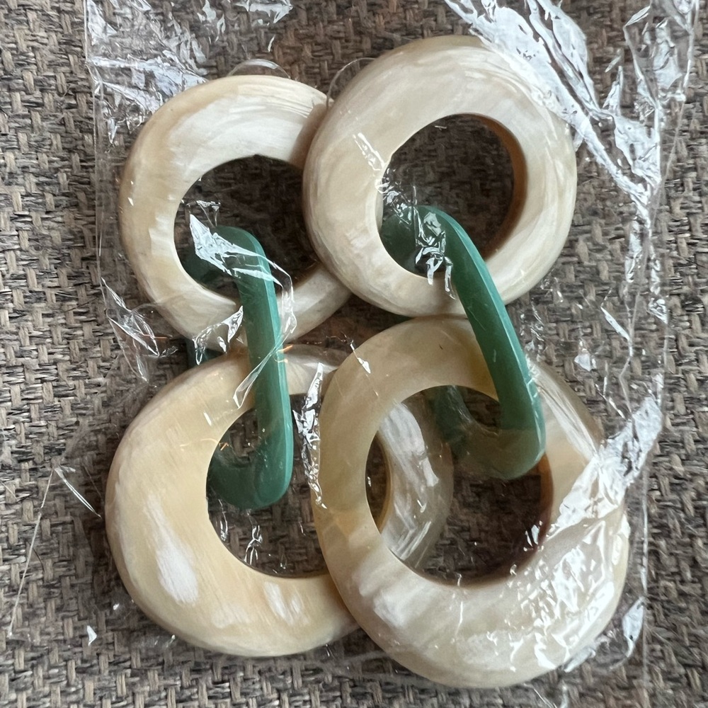 Noonday earrings made of buffalo horn.